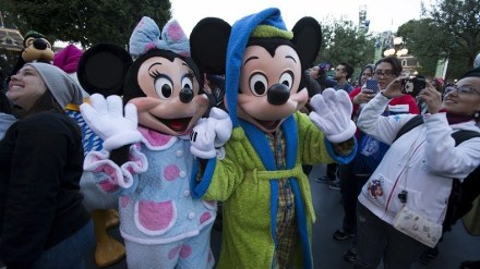 The characters of Mickey Mouse and Minnie Mouse greet guests during Disneyland's Diamond Celebration in Anaheim