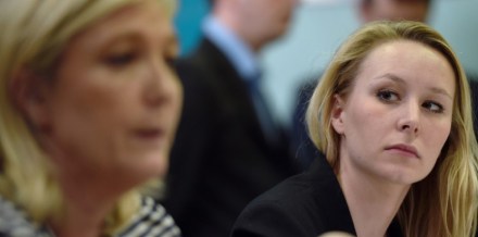 France's far-right National Front (FN) party MP Marion Marechal Le Pen (R) gives a press conference with the party's leader Marine Le Pen on March 17, 2015 in Le Pontet, southern France, ahead of the March 22 and 29 departemental local elections. AFP PHOTO / ANNE-CHRISTINE POUJOULAT