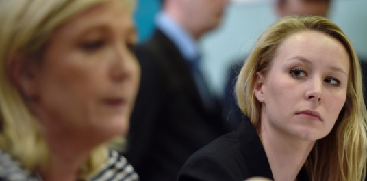 France's far-right National Front (FN) party MP Marion Marechal Le Pen (R) gives a press conference with the party's leader Marine Le Pen on March 17, 2015 in Le Pontet, southern France, ahead of the March 22 and 29 departemental local elections. AFP PHOTO / ANNE-CHRISTINE POUJOULAT