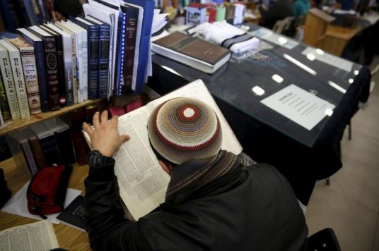 903948-a-student-reads-during-a-lesson-at-the-bnei-david-academy-in-the-west-bank-jewish-settlement-of-eli