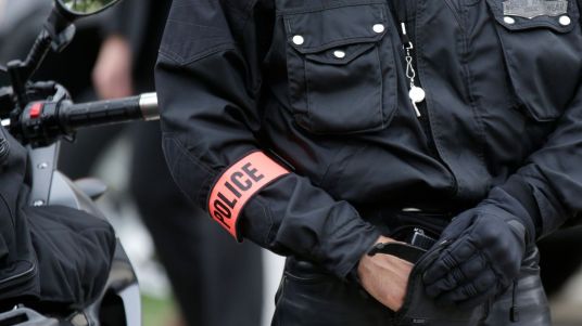 a-french-policeman-holds-his-automatic-weapon-as-he-secures-us-secretary-of-state-kerry-s-arrival-at-the-quai-d-orsay-foreign-ministry-for-a-meeting-with-french-foreign-affairs-minister-fabius-in-pari